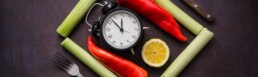 Intermittent fasting clock on chopping board